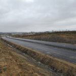 1 km 69+200 ułożone warstwy asfaltowe (przeciwnie do km)