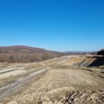 15 km 75+000 ułożone warstwy nawierzchni, roboty ziemne (przeciwnie do km)