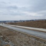 2 km 69+200 ułożone warstwy asfaltowe (przeciwnie do km)