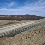 18 km 75+000 ułożone warstwy nawierzchni, roboty ziemne (przeciwnie do km)
