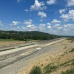 15 km 75+000 ułożone warstwy nawierzchni, roboty ziemne (przeciwnie do km)