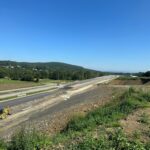 11 km 75+000 ułożone warstwy nawierzchni, roboty ziemne (przeciwnie do km)